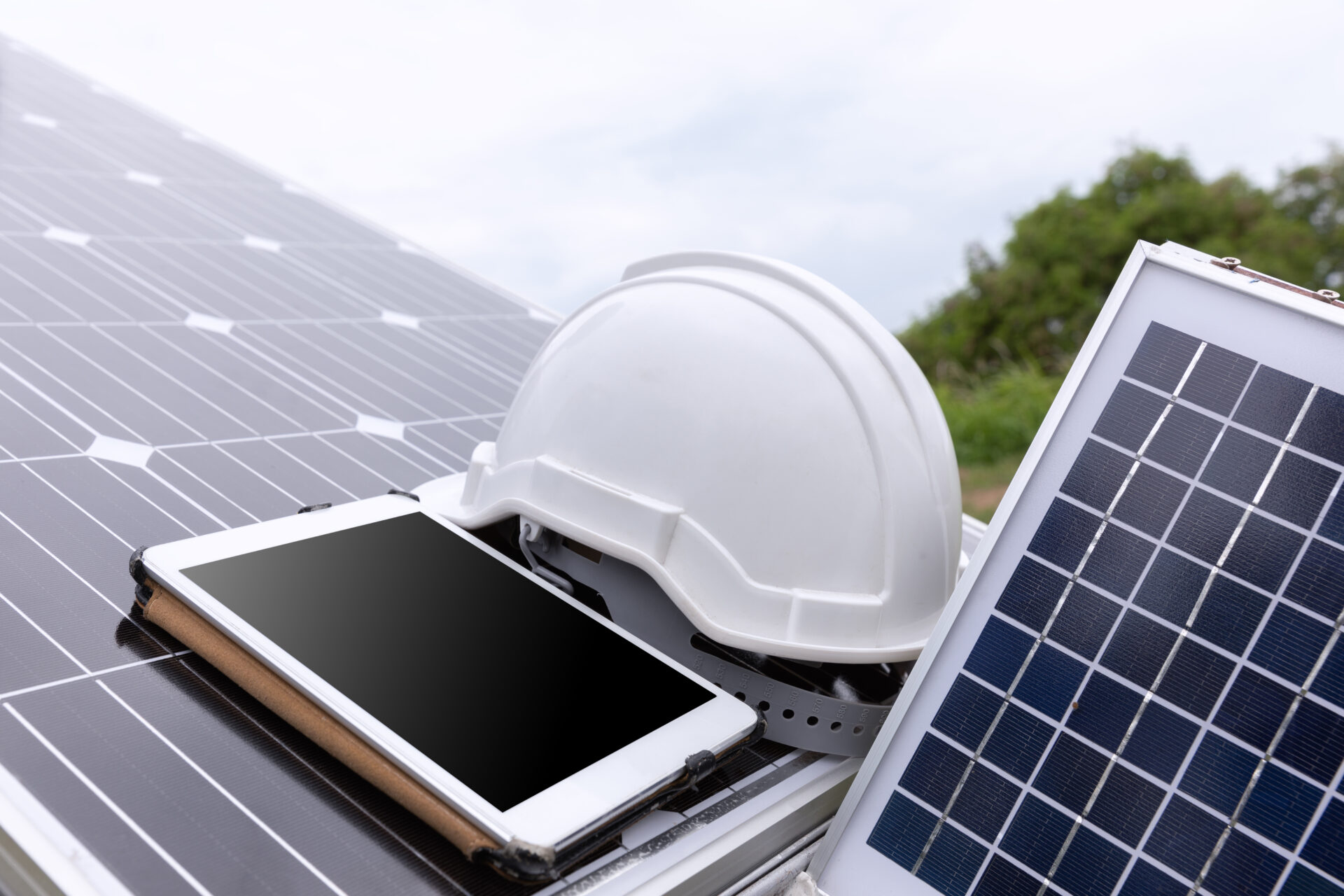 solar photovoltaic panels station checks with tablet computer